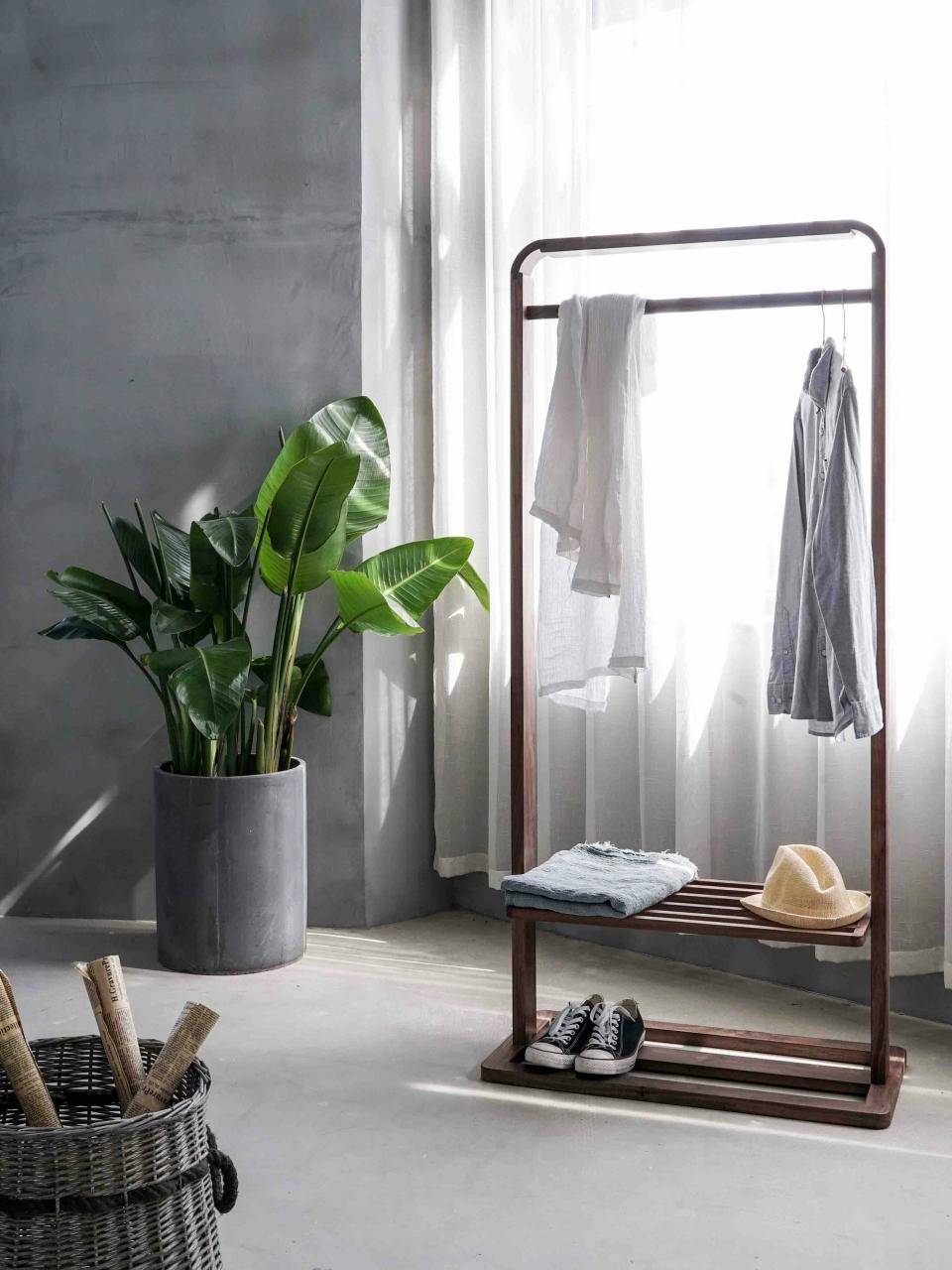 Clothing rack with greenery indoors